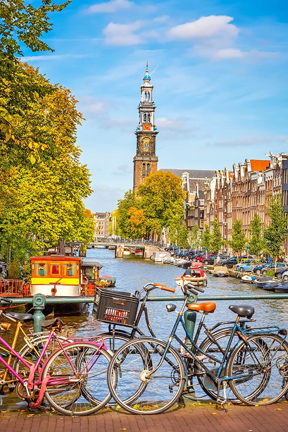 Bicycles next to a canal in Amsterdam in fall