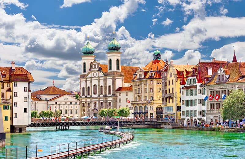 Colorful buildings by the river in Lucerne (Switzerland)