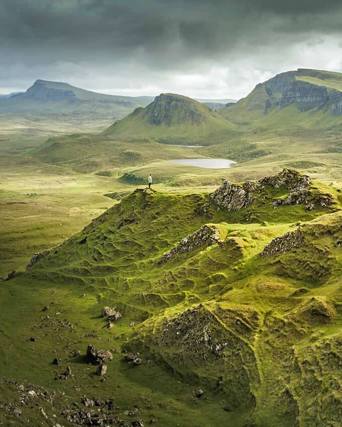 What to aim for while planning a trip to Scotland: lush green valley with lakes and hills 