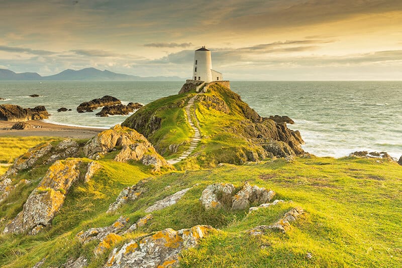 Lighthouse perched on a cliff in the Irish countryside