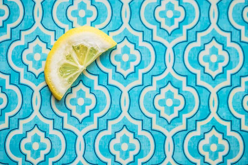 Slice of Key lime on a blue and white tile