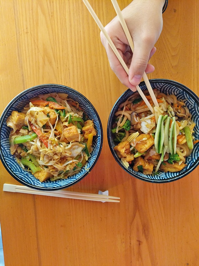 Two bowls of noodles with vegetables at Cup Noodles Museum in Yokohama