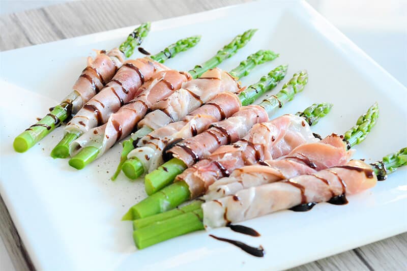 Fresh asparagus wrapped in Italian prosciutto with balsamic vinegar from Modena