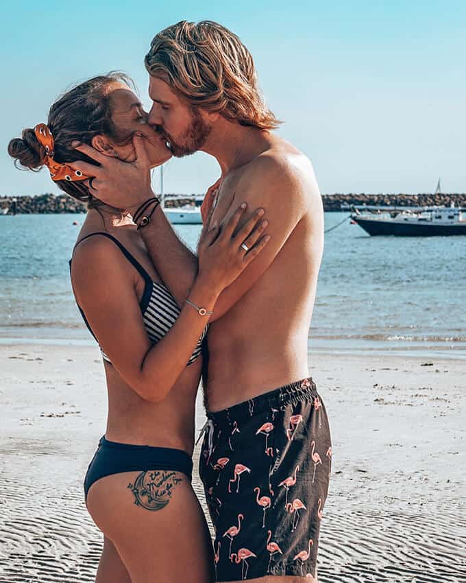 Couple kissing on the beach in Ischia, Italy