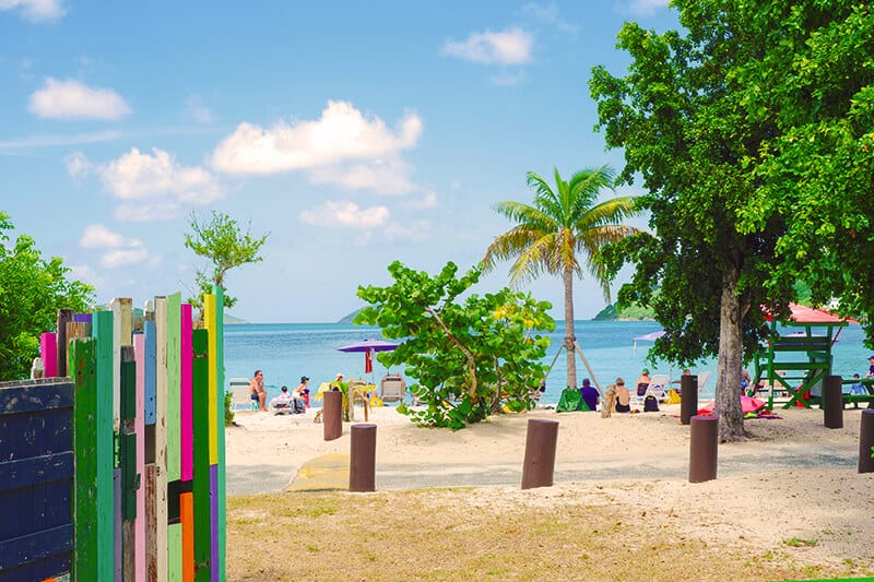 Colorful wooden installation and palm trees at Sapphire Beach St Thomas