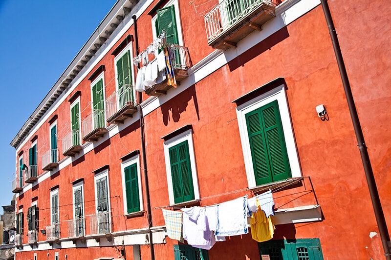 Orange-colored building in Procida (Italy)
