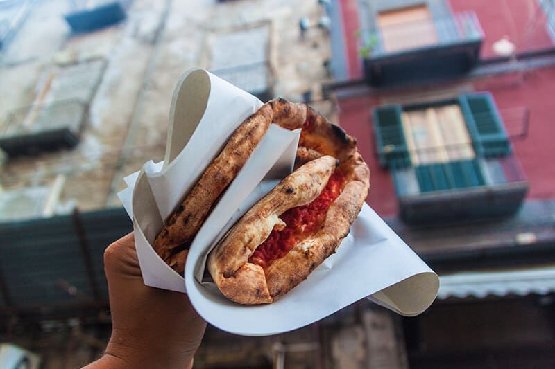 Pizza a Portafoglio in one of the vicoli in Naples Italy