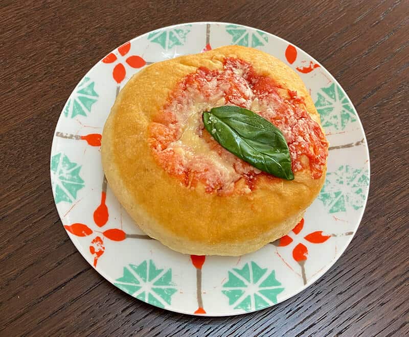 Neapolitan Pizza Montanara with basil on a decorated plate from Vietri on the Amalfi Coast