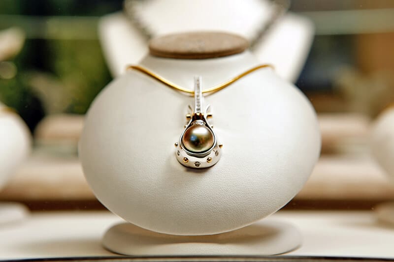 Hawaiian black pearl on a golden necklace