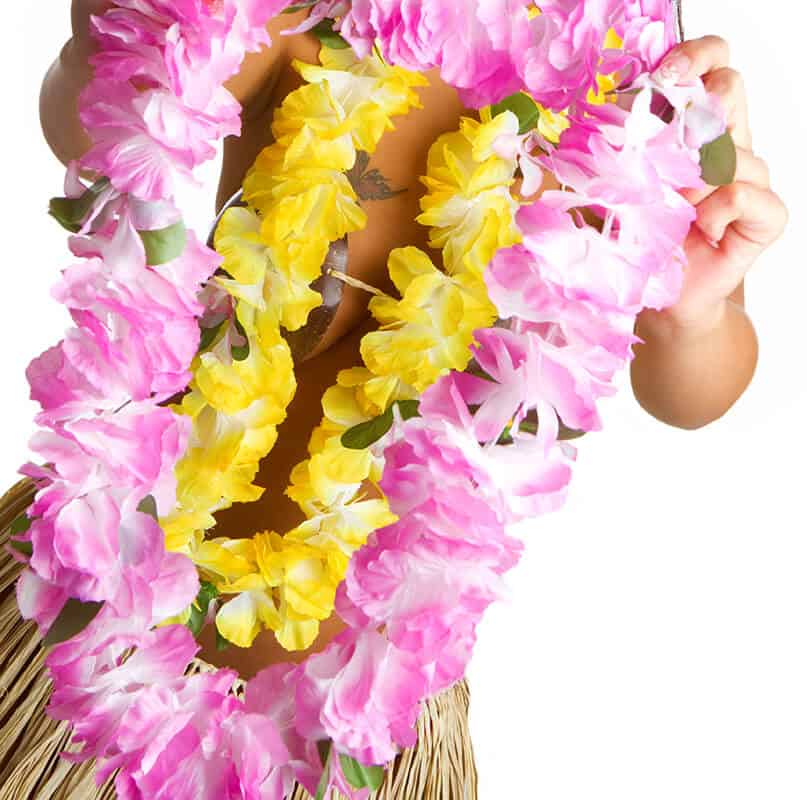 Hawaiian luau dancer holding pink and yellow lei garlands