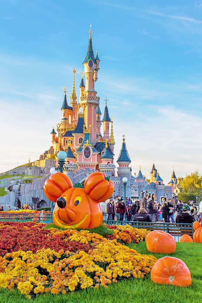 Mickey's pumpkin in front of Cinderella's Castle at Disney World for Halloween
