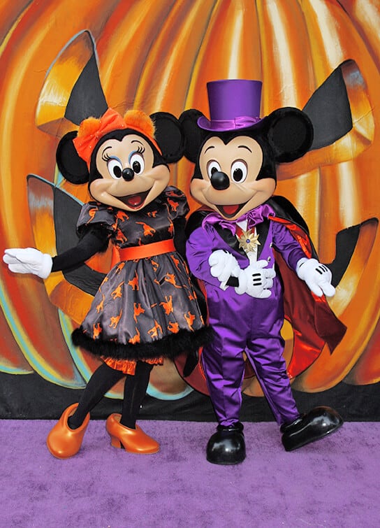 Minnie Mouse and Mickey Mouse dressed up for Halloween at Disney World