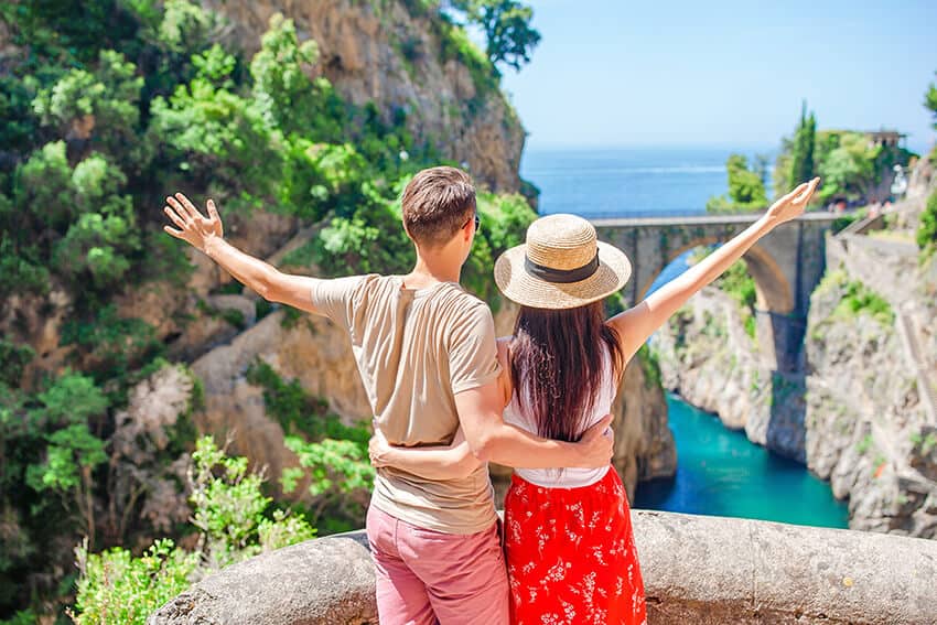 Young couple enjoying the view at Furore on the Amalfi Coast (Italy)