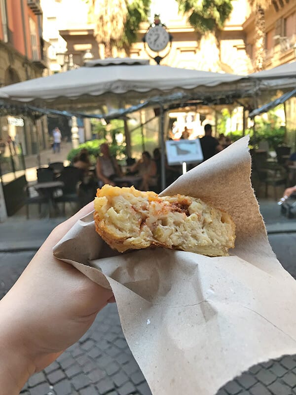 Dany eating frittatina in Naples (Italy)