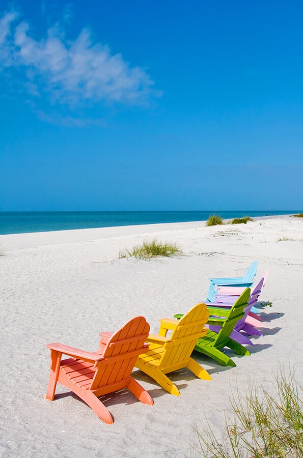 Pastel colored beach chairs in Sanibel (FL)