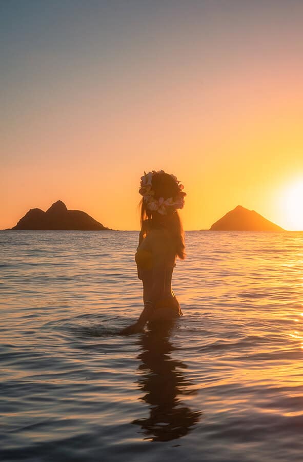 Woman looking at the sunset in Oahu