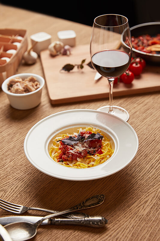 Pasta with ragu sauce and aglianico wine