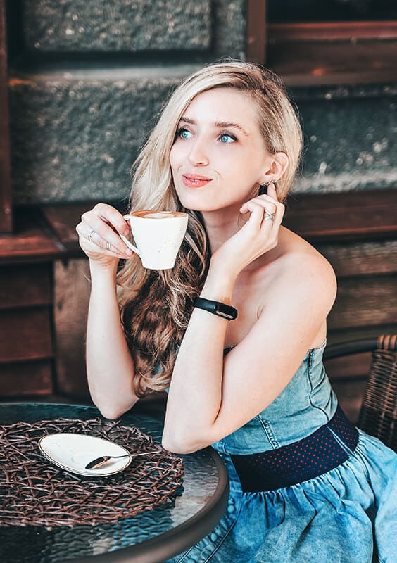 Girl drinking cappuccino in Italy