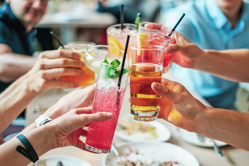 People toasting with Italian drinks