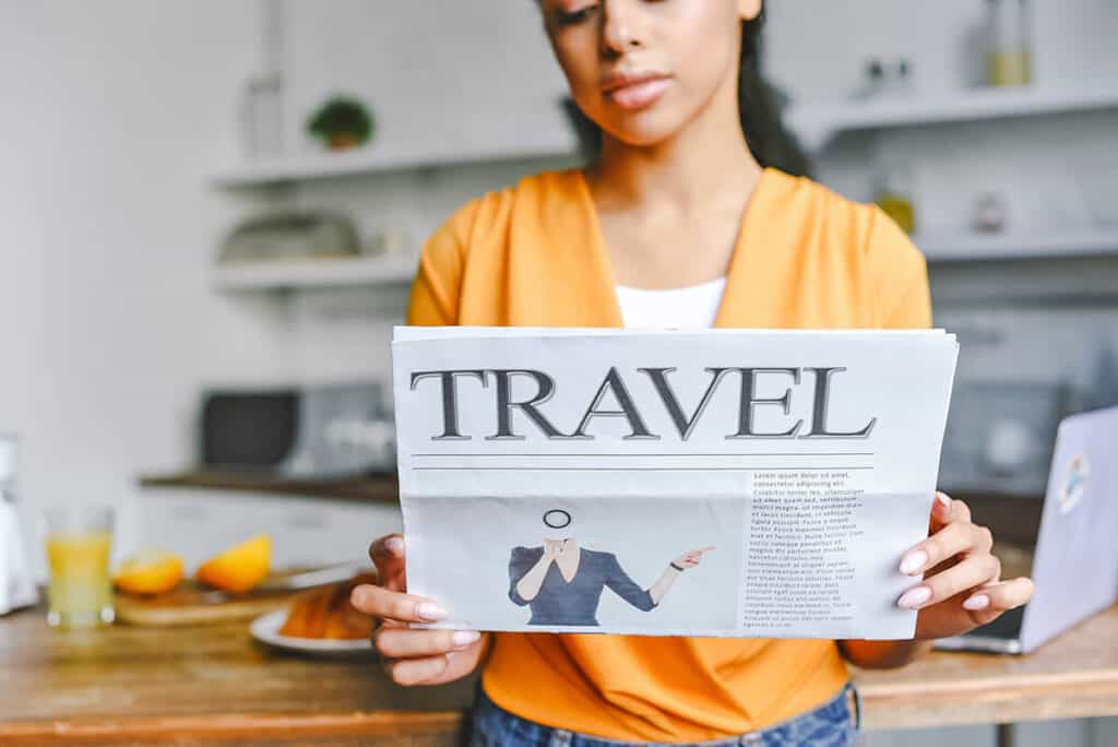 Woman holding a travel magazine