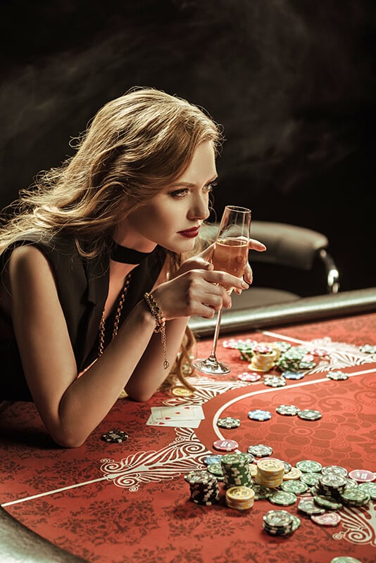 Woman sitting next to poker chips