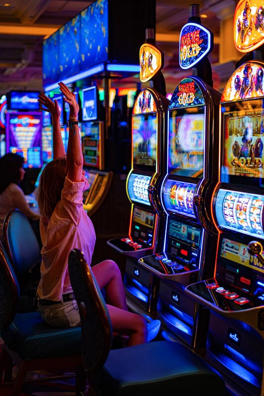 Woman having fun at slot machines