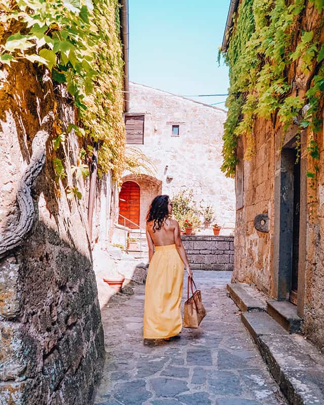 Woman in a dress walking in Italy