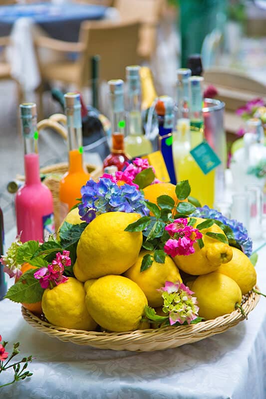 Bowl of Amalfi Coast lemons with flowers