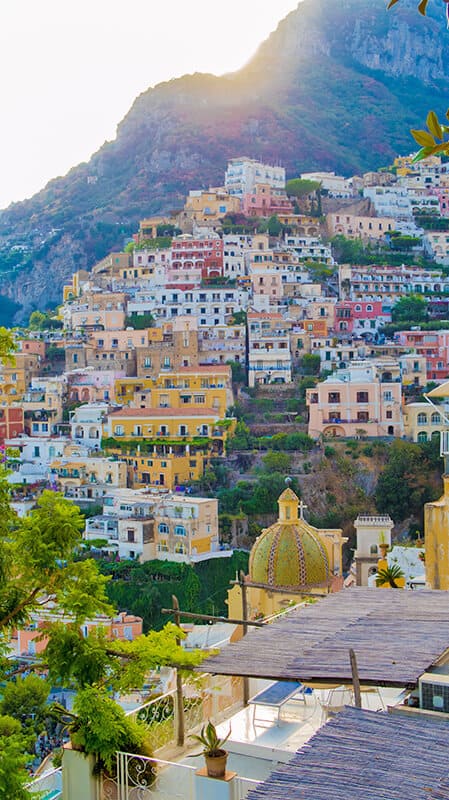 Positano church dome next to the colorful houses