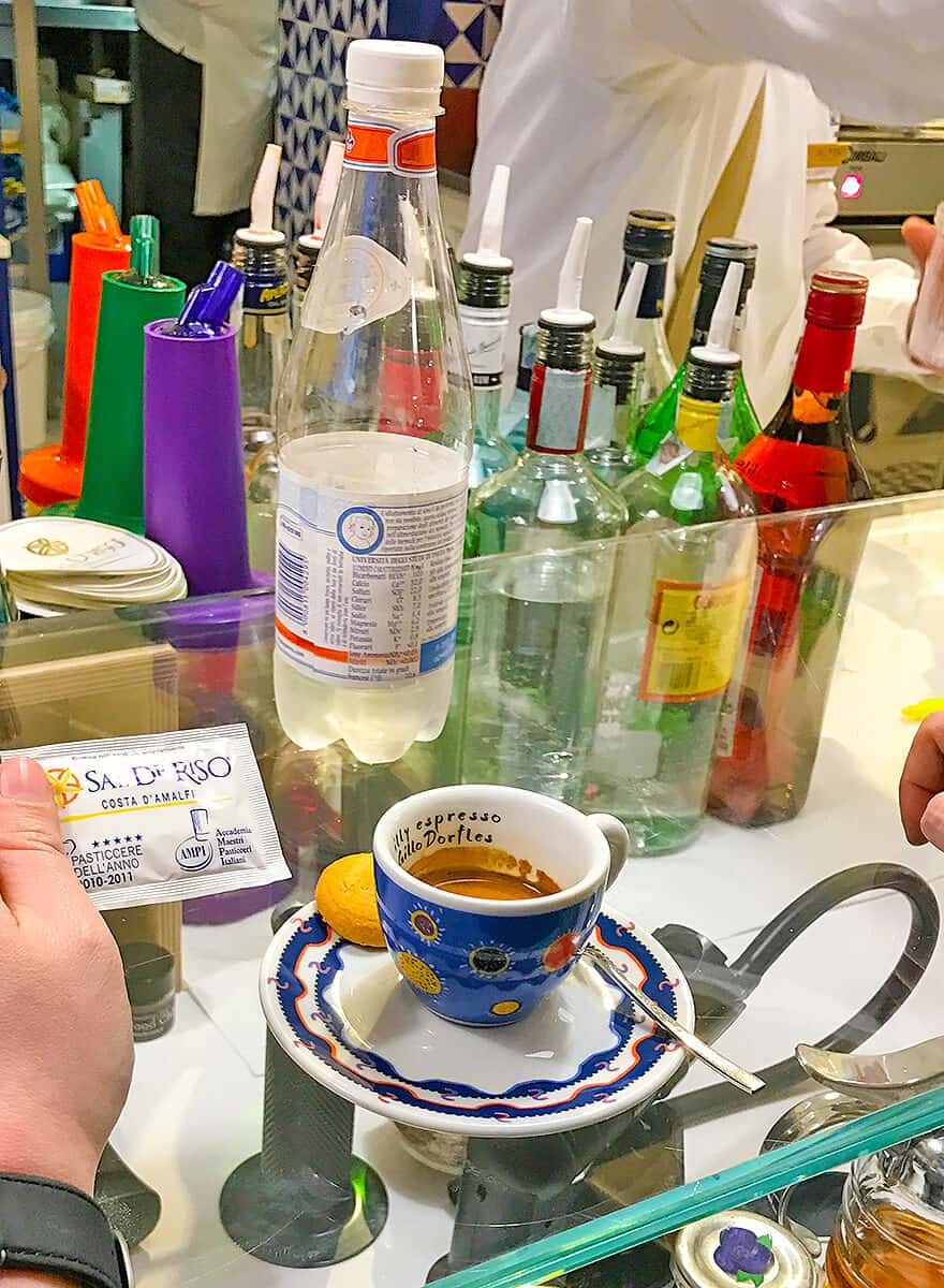 Dany drinking from a hand Painted espresso cup