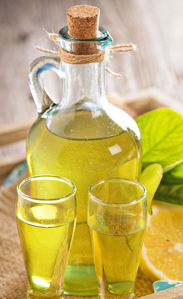 Homemade limoncello with glasses