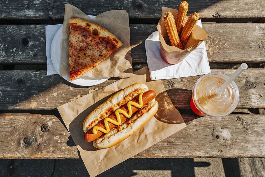 Best street food in NYC: a hot dog, churros, pizza and a soda